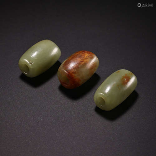 A GROUP OF HETIAN JADE BEADS FROM THE HONGSHAN PERIOD