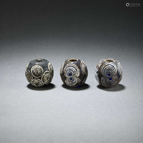 A SET OF DRAGONFLY EYE GLASS BEADS IN THE WAR AND HAN DYNAST...