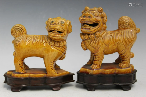 Two Yellow Glazed Chinese Porcelain Foo Dogs on Wood Stands