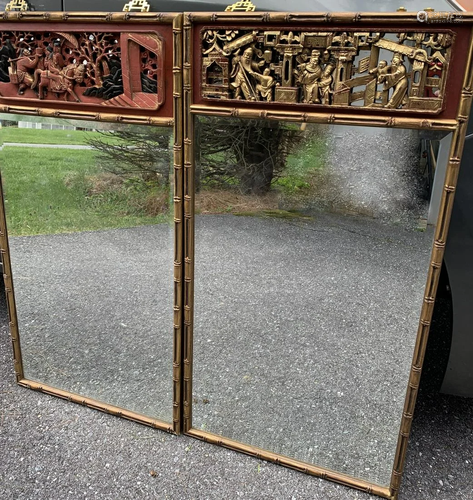 Two Chinese carved wood panel mirrors.