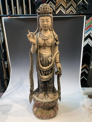 Wood carving of a Guan Yin