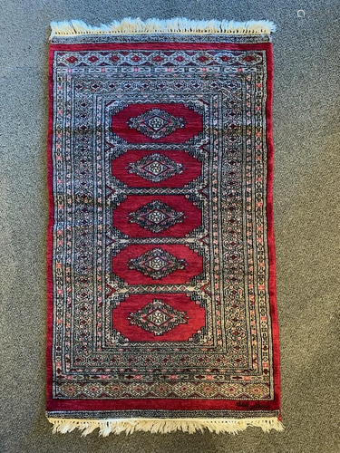 Signed Bokhara hand woven wool rug