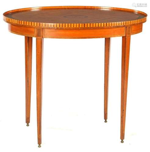 Oval oak table with several types of wood veneer