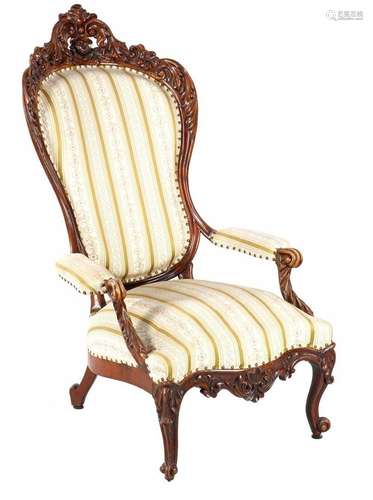 Mahogany richly decorated voltaire with classic upholstery