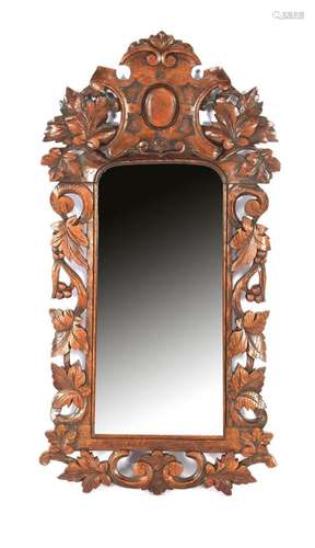 Mirror in oak richly decorated frame