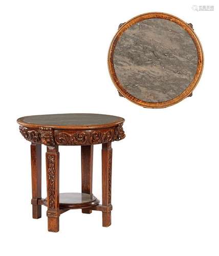 Round oak table with richly decorated frame