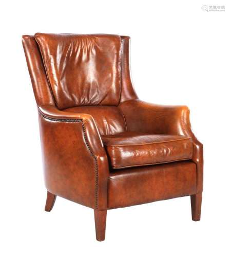 Brown leather arm chair on walnut legs