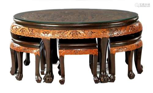 Oval Chinese wooden table with richly decorated décor