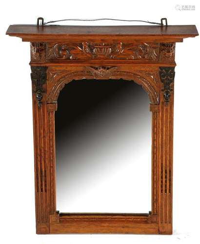 Mirror in richly decorated oak frame