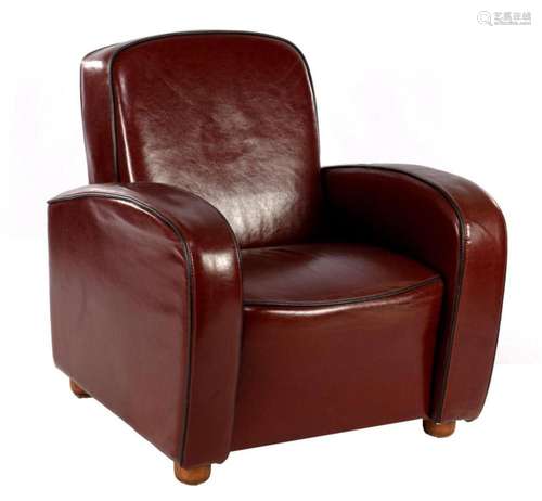 Brown leather armchair with black edges