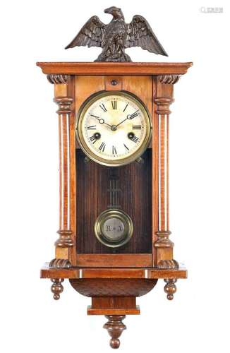 Regulator in walnut cabinet with eagle on top