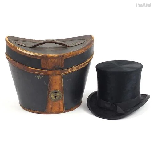Early 20th century J T Ogdens top hat with leather case, the...