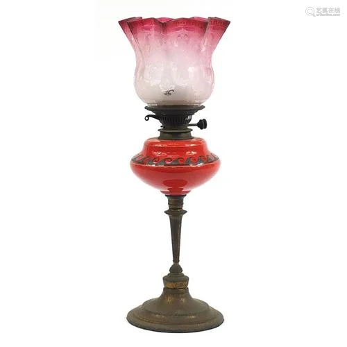Victorian brass oil lamp with etched cranberry glass shade, ...