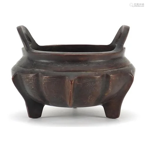 Chinese patinated bronze three footed censer with silver inl...