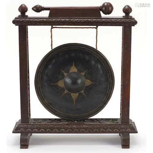 Early 20th century gong with oak frame profusely carved with...