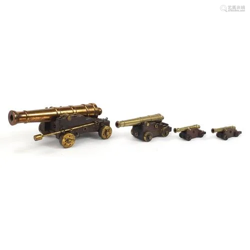 Four antique and later Naval interest bronze table cannons o...