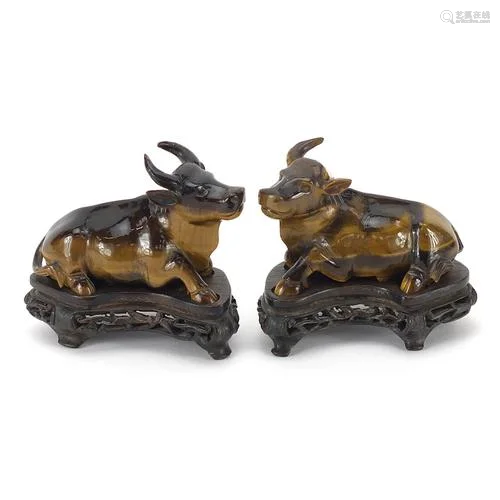 Pair of Chinese carved tiger's eye water buffalo, each ...
