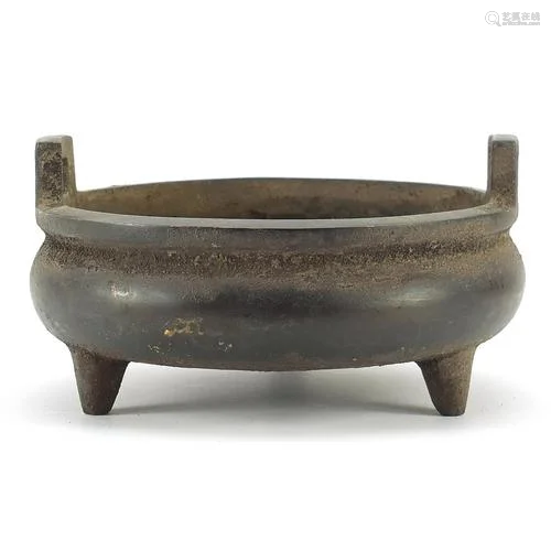 Chinese patinated bronze three footed censer with twin handl...