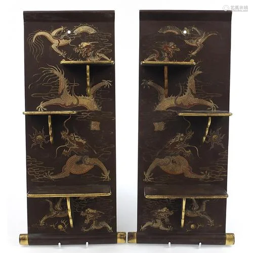 Pair of Chinese lacquered wall plaques with folding shelves,...