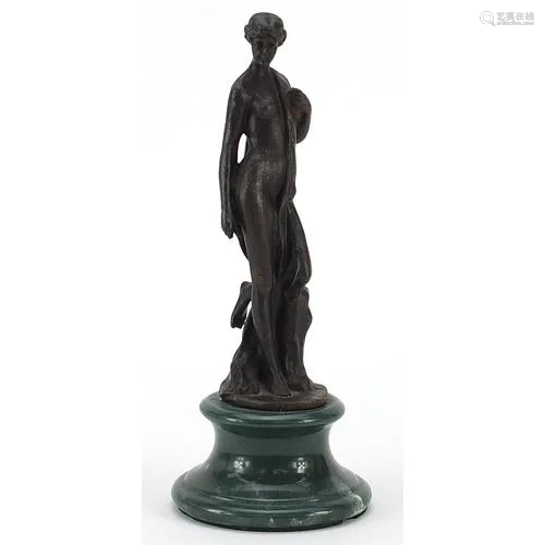 Patinated bronze study of a standing semi nude female raised...