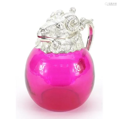 Silver plated and cranberry coloured glass jug in the form o...
