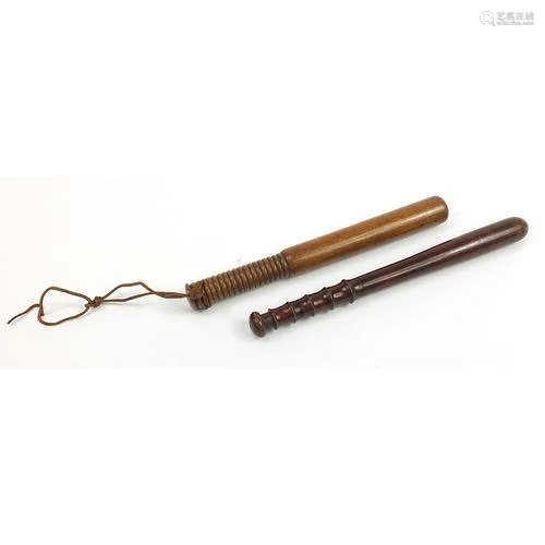 Two turned wood police truncheons, the largest 39cm in lengt...