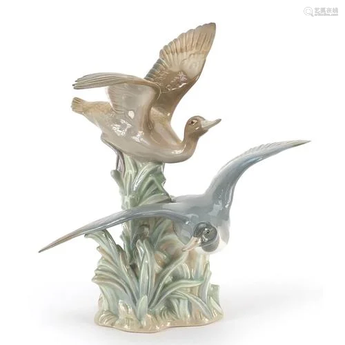 Large Lladro model of two ducks in flight, 30cm high