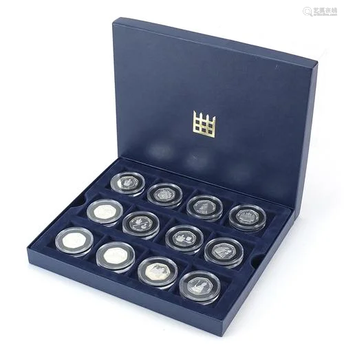 Twelve Coronation Jubilee silver proof fifty pence pieces wi...