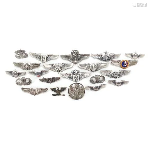 Collection of American military interest badges including pa...