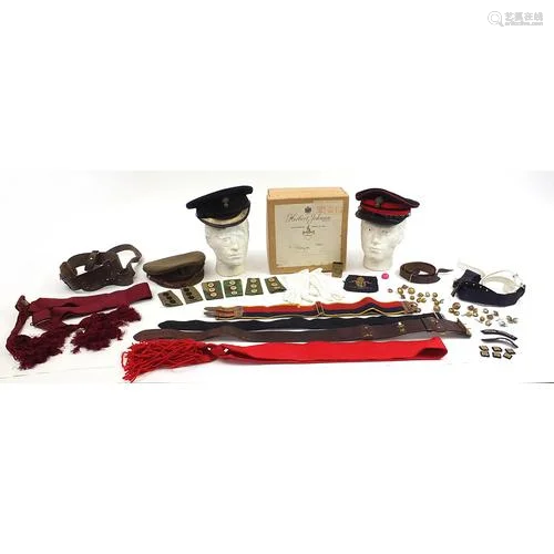 Militaria including peaked caps and a leather Sam Browne