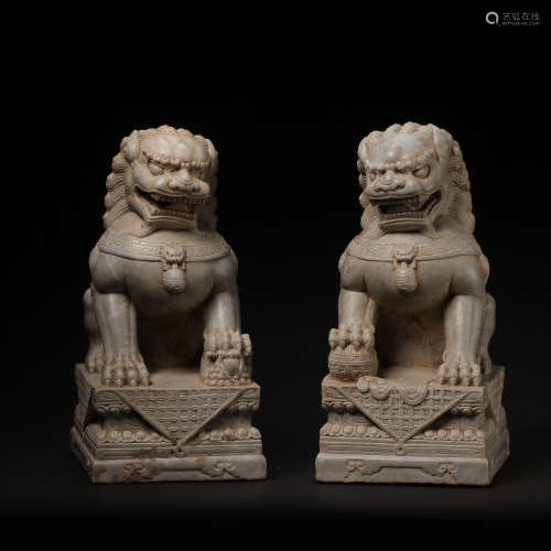 A PAIR OF BLUE AND WHITE STONE LIONS, MING DYNASTY, CHINA, 1...