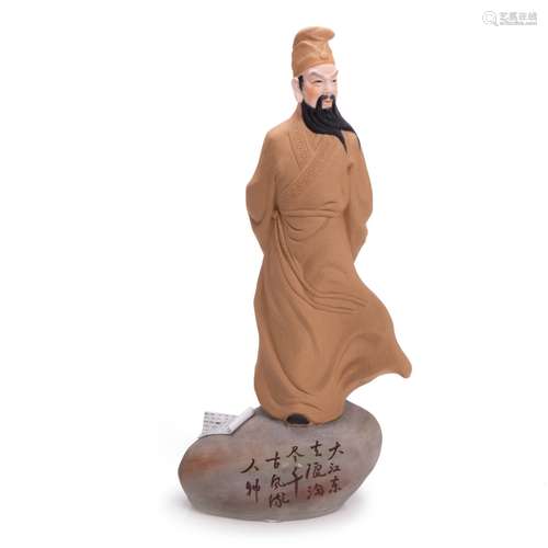 CHINESE CERAMIC FIGURE STANDING ON BOLDER