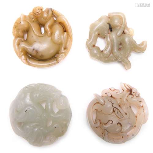 GROUP OF 4 ROUND JADE TOGGLES