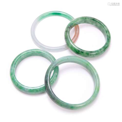 GROUP OF FOUR JADE BANGLES