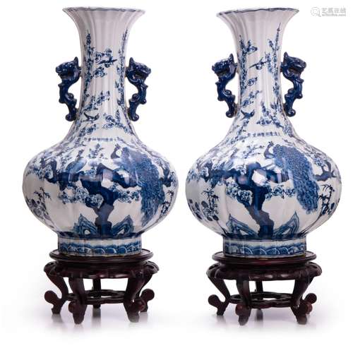 PAIR OF LOBBED, FLAIRED BLUE AND WHITE VASES