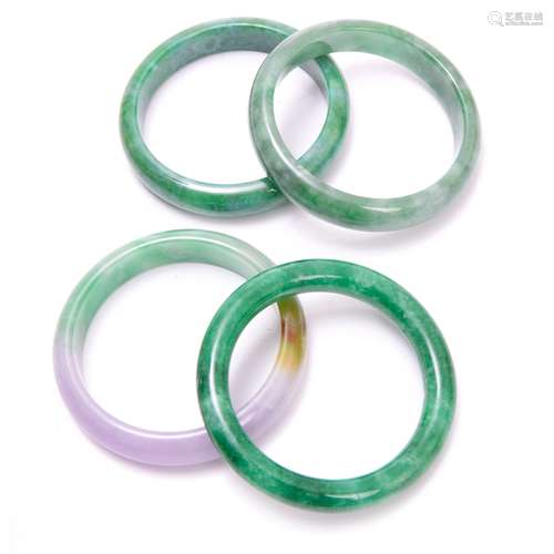 GROUP OF FOUR JADE BANGLES