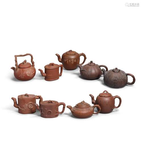 A GROUP OF NINE YIXING TEAPOTS AND COVERS 19th/20th century