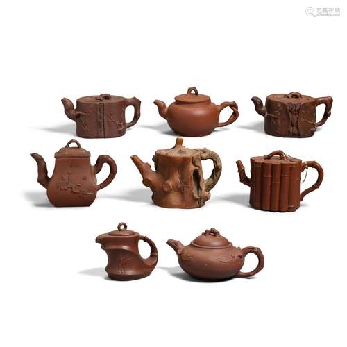 A GROUP OF EIGHT YIXING TEAPOTS AND COVERS Late 19th/20th ce...