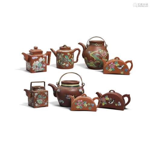 A GROUP OF EIGHT ENAMELED YIXING TEAPOTS AND COVERS Late Qin...