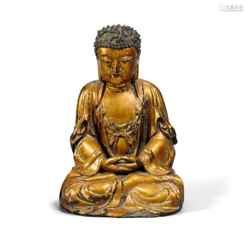 A GILT-LACQUERED WOOD FIGURE OF SEATED BUDDHA Ming dynasty