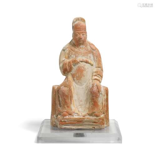 A POTTERY FIGURE OF A SEATED OFFICIAL Ming dynasty