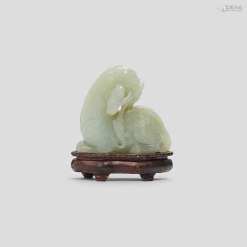 A CELADON JADE 'MYTHICAL BEAST AND LINGZHI' GROUP Qi...