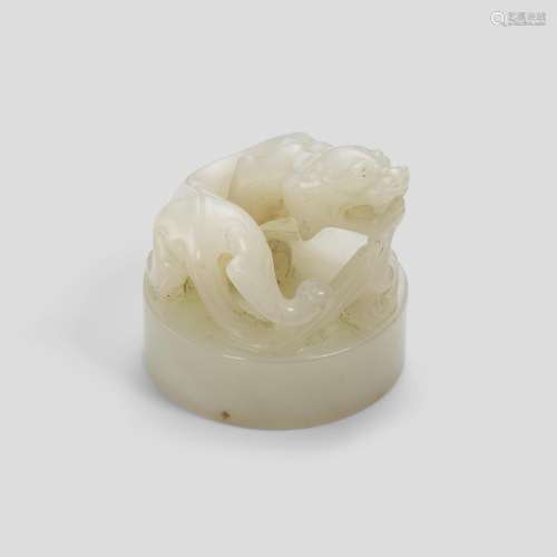 A WHITE JADE 'SHOU' SEAL WITH A CHILONG-FORM FINIAL ...