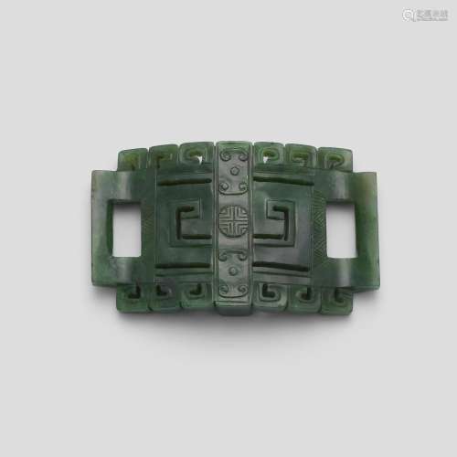 A SPINACH-GREEN JADE BELT BUCKLE Late Qing dynasty