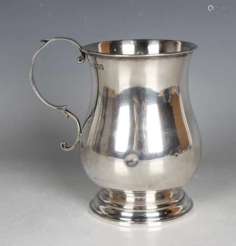 A late Victorian silver baluster tankard with scroll handle ...