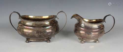 A George IV silver two-handled sugar bowl and matching milk ...