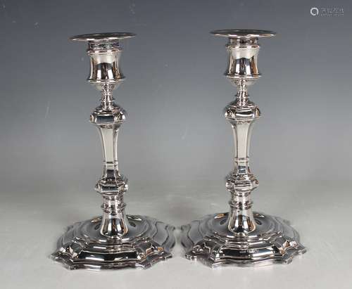 A pair of Elizabeth II silver candlesticks, each with a deta...