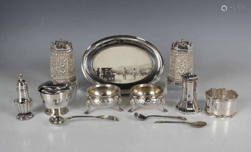 A pair of Victorian silver circular salts, engraved with ste...