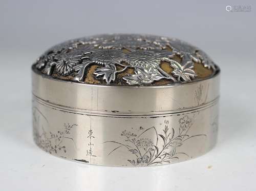 A Japanese silver circular box and cover, the domed cover ca...