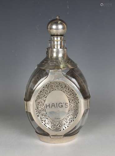 A Haigs whisky silver mounted clear glass dimple decanter an...